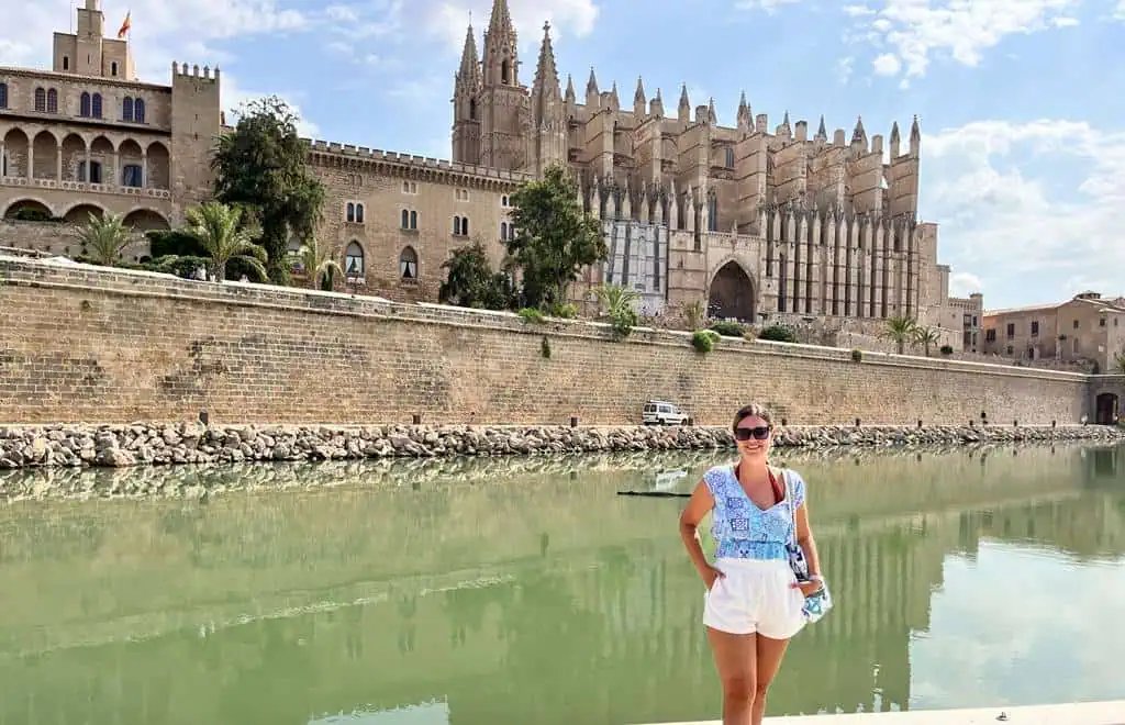 Me posing in front of Palma Cathedral and Palace of La Almudaina
